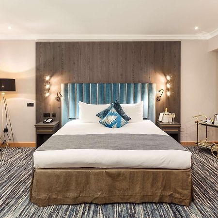 โรงแรมคอร์ตเฮาส์ ลอนดอน ภายนอก รูปภาพ A bedroom at the hotel